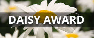 Banner picture of some daisies. Banner says:
Daisy Award